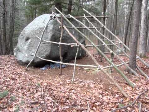 shelter against a rock