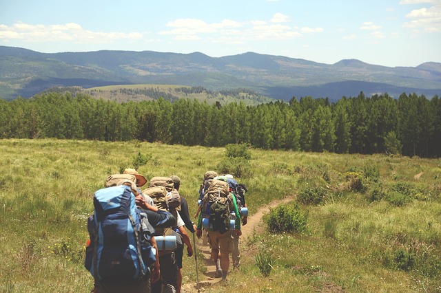 Group Backpacking Through Field